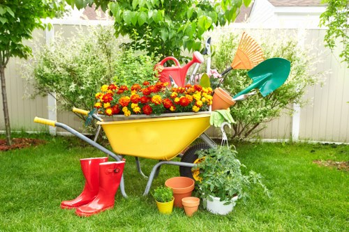 Gardener in West Hendon preparing a transparent quote for a small residential garden